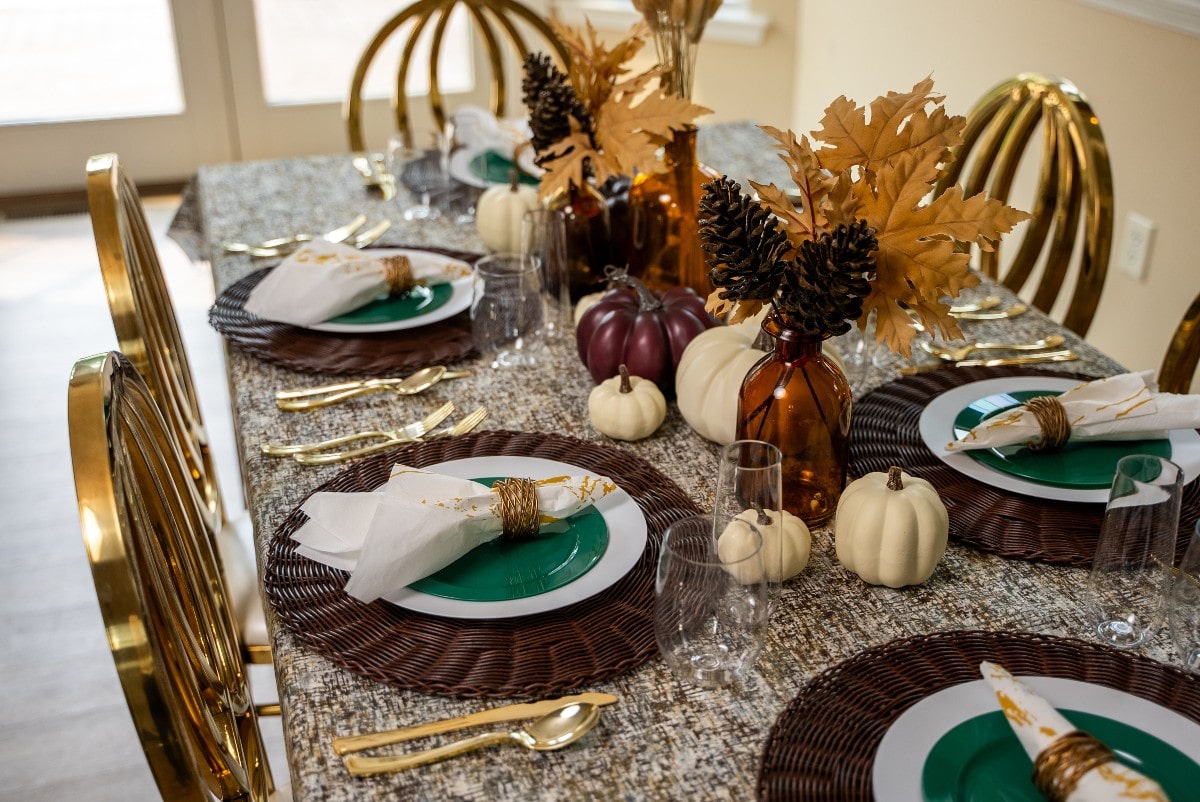 Elegant Friendsgiving ideas for table setting featuring fancy disposable tableware, perfect for a festive gathering with friends.