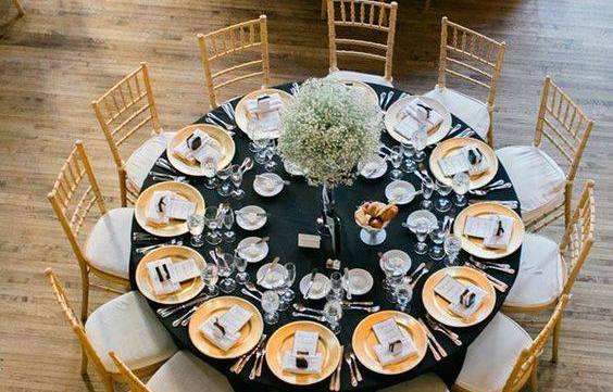 Elegant wedding reception table with high-quality disposable party supplies and stylish table decorations.