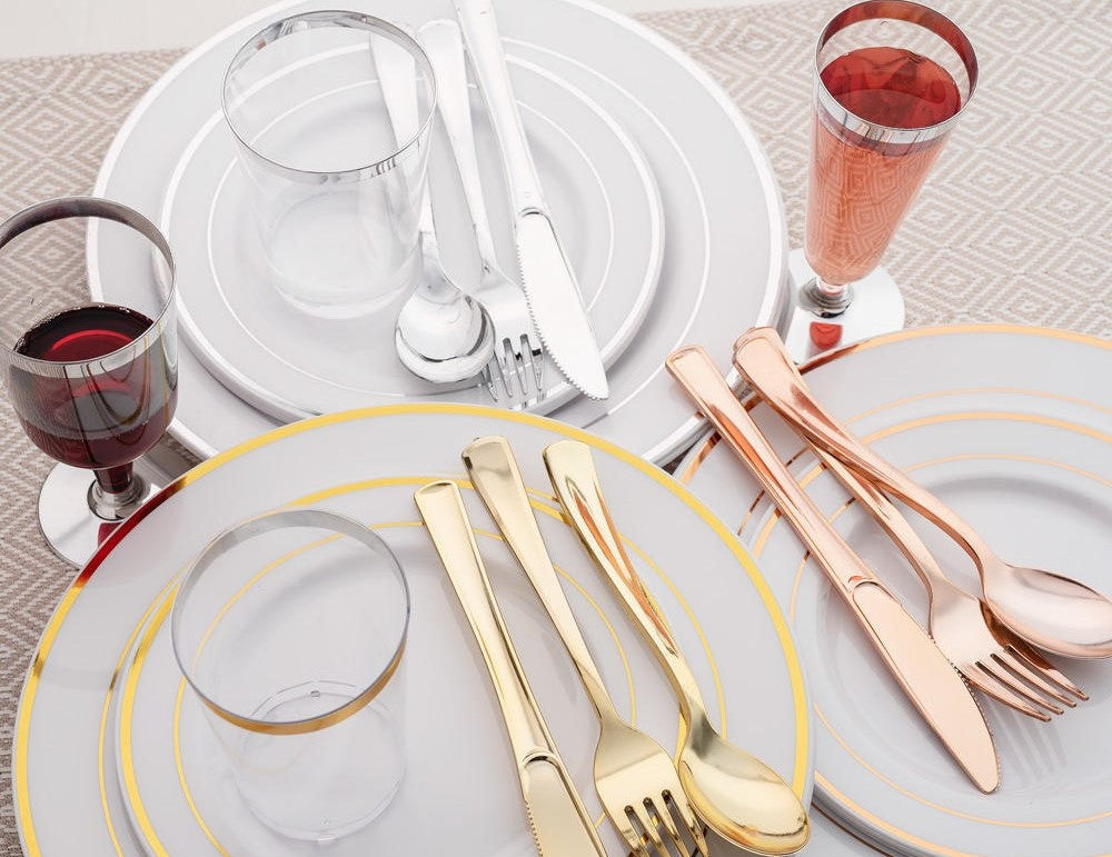 Elegant plastic plates, cutlery, and glasses for a stylish, hassle-free dining setup.