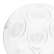 The 12" Clear with Silver Round Section Tray Disposable Plastic Seder Plates feature six designated indentations for traditional Passover foods. Each clear compartment, accented with silver, is labeled in Hebrew with texts such as "Beitzah" (egg), "Maror" (bitter herbs), and "Charoset." This elegant yet disposable option is perfect for maintaining the sanctity and style of the occasion.