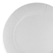 A close-up of a Glitz White Round Disposable Paper Charger Plate (13") designed for elegant table settings. The plate features a subtle, light gray pattern of small dots evenly distributed across its surface. The edges are slightly scalloped, adding a decorative touch ideal for special occasions. The background around the plate is white.