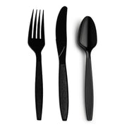 A sleek Black Disposable Plastic Cutlery Set, including a fork, knife, and spoon, is arranged side by side on a white background.