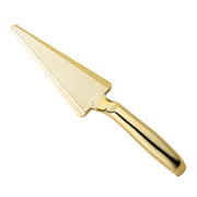 The Shiny Gold Disposable Plastic Cake Cutters/Lifters are displayed against a white background. The smooth, shiny handle matches the elegant finish of the entire utensil. The serrated edge runs along one side of the triangular, flat serving blade, making this two-in-one design both stylish and functional.