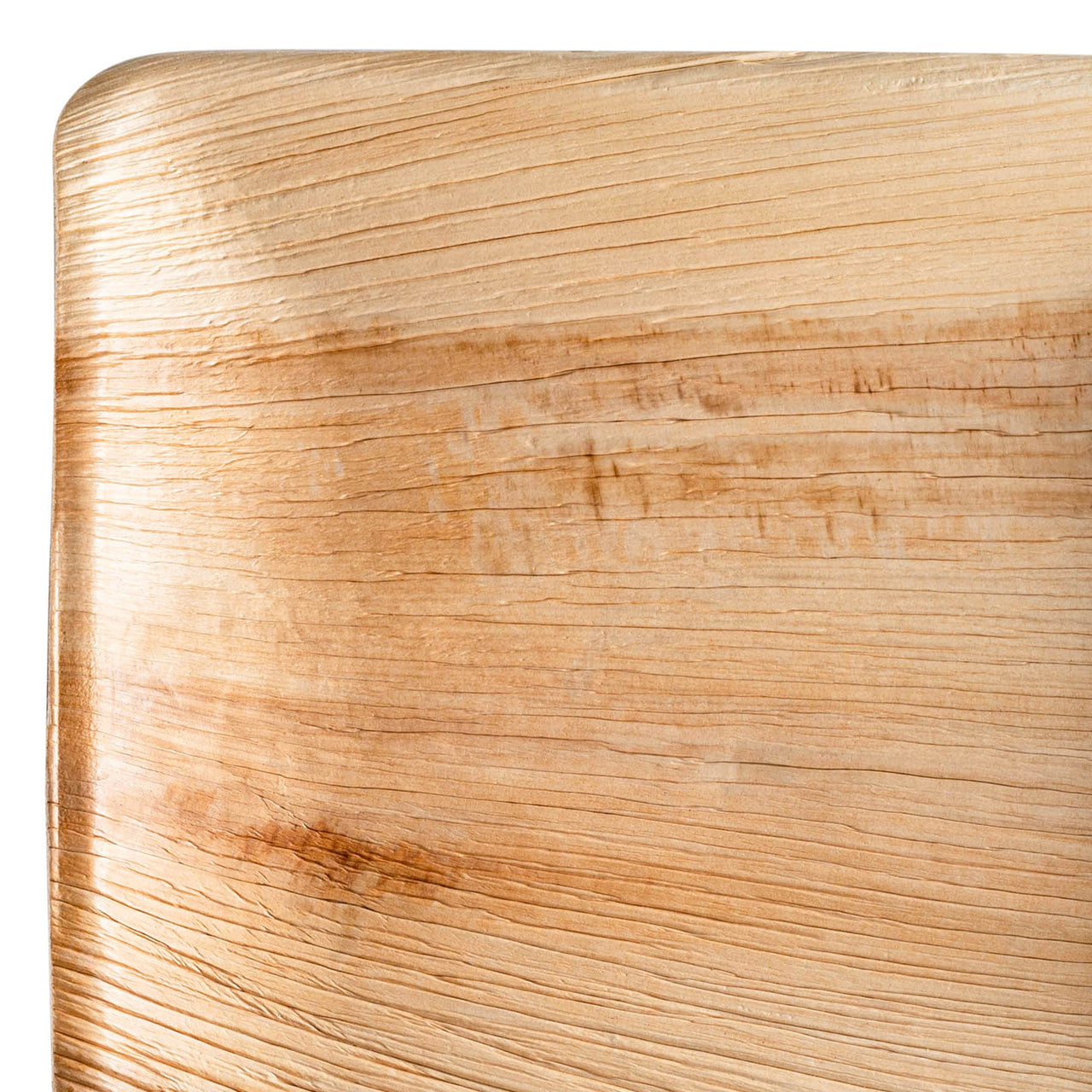 Close-up of a Square Palm Leaf Eco Friendly Disposable Buffet Plate (9") from the Kaya Collection, highlighting its light natural finish and the intricate texture and grain patterns. The plate's corner is slightly rounded, showcasing both linear and wavy grain lines that are reminiscent of sustainable dinnerware design.