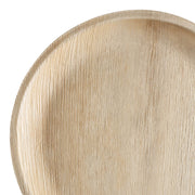 Close-up of a Round Palm Leaf Eco Friendly Disposable Platter (12") with a textured surface made from natural fibers. The irregular lines and grooves suggest a rustic or handmade design, and the light beige color gives it an organic appearance. The image captures a partial view of this eco-friendly piece.