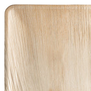 Image of Square Palm Leaf Eco Friendly Disposable Platters (11"): A close-up view of a corner showcasing the natural wood-like texture with visible grain lines. These compostable, disposable platters highlight the organic and eco-friendly material, featuring slightly curved edges for added elegance.