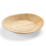 The Kaya Collection Round Palm Leaf Eco Friendly Disposable Pastry Plate (5") is a shallow, single-use plate made from natural palm leaf material. Featuring a smooth texture and light brown color with subtle grain patterns, this biodegradable plate boasts a rustic, organic appearance.
