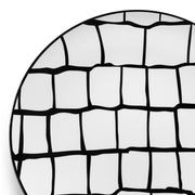 A close-up of an elegant design plate named "White with Black Scales Pattern Round Disposable Plastic Dinner Plates (10.25")." The plate features a pattern of hand-drawn black lines forming irregular rectangular shapes, creating a striking black grid against the white background. This sophisticated contrast makes it perfect for any stylish gathering or event.