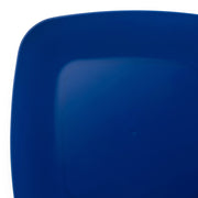 A close-up view of the corner of a deep blue Blue Flat Rounded Square Disposable Plastic Buffet Plate (8.5"). The plate's glossy surface reflects light, adding a subtle gradient effect to the rich blue color. The background is entirely white, emphasizing its elegant and practical choice for any setting.