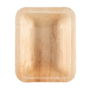 The Rectangular Natural Palm Leaf Eco-Friendly Disposable Dessert Plate (6" x 4") is a light brown, biodegradable plate crafted from natural materials. Its compostable design features a textured surface that resembles wood grain, accompanied by slightly curved-upward edges.