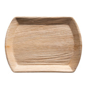 The 13" x 9" Rectangular Natural Palm Leaf Eco-Friendly Disposable Tray is an eco-friendly, compostable serving tray crafted from natural palm leaf. It features a textured surface with visible wood grain patterns, and has a shallow depth with slightly raised edges, making it suitable for serving food. The tray's color is a light, natural wood tone.