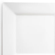 A close-up of a plain, empty White Square Plastic Dinner Plate (10.25") by Kaya Collection with raised edges, set against a white background. The simplicity of the design emphasizes minimalism and cleanliness, making it an elegant piece of tableware.