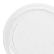 A close-up of the Kaya Collection's Clear Floral Round Disposable Plastic Appetizer/Salad Plates (7") highlights their elegant design, featuring clear or frosted plastic with intricate floral patterns embossed along the rim and within the central portion. The plates boast a smooth surface adorned with detailed, symmetrical flower designs arranged in a decorative manner, making them perfect for any occasion.