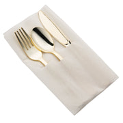 The Gold Plastic Cutlery in White Pocket Napkin Set includes a gold-colored fork, knife, and spoon neatly arranged inside a white napkin with pockets. The napkin is carefully folded to secure the utensils, resulting in an elegant and organized table setting for your party.