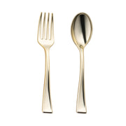 A gold-toned fork with four tines from the Kaya Collection Gold Disposable Plastic Mini Flatware Set is paired with a matching gold dessert spoon, each featuring sleek, modern designs and smooth, slightly curved handles. Set against a plain white background that emphasizes their reflective surfaces, this cutlery is perfect for an elegant event party set.