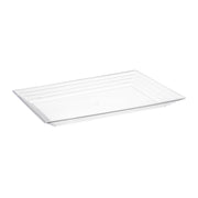 The Kaya Collection 11" x 16" Clear Rectangular with Groove Rim Plastic Serving Tray boasts a minimalist design and clean lines, making it ideal for any occasion. Its slightly raised edges give the tray a lightweight appearance. Against the plain white background, this piece truly stands out among other rectangular serving trays.