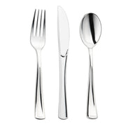 A set of three shiny metallic silver pieces from the Kaya Collection's Shiny Metallic Silver Plastic Cutlery Combo Set, displayed vertically on a white background: a fork with four tines on the left, a serrated knife in the middle, and a spoon on the right.