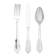 The Kaya Collection's Shiny Metallic Silver Baroque Plastic Cutlery Set includes 24 forks, 24 knives, and 24 spoons. Each piece boasts intricate decorative designs on the handles, showcasing elaborate patterns reminiscent of Baroque style cutlery. The silverware is polished and neatly arranged side by side.