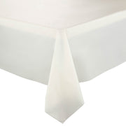 A close-up shot of the neatly draped Ivory Rectangular Disposable Plastic Tablecloth hanging over the corner of a table. The fabric appears smooth and falls in clean, straight lines, giving an elegant and minimalistic look. The background is plain white.