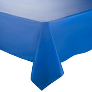 Close-up of a table corner covered with a smooth, vibrant Navy Rectangular Disposable Plastic Tablecloth by Kaya Collection (54" x 108"). The elegant table cover drapes neatly over the edge, creating clean lines and a sleek appearance. The background is plain white, drawing attention to the tablecloth's color and texture.