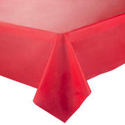 A close-up view of a Red Rectangular Disposable Plastic Tablecloth (54" x 108") draped over the corner of a table, with the fabric hanging down smoothly and a slight sheen visible on the surface. The background is plain and white, highlighting the vibrant red color of the tablecloth, making it perfect for any event planning.