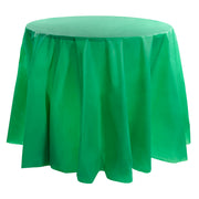 The Hunter Green Round Disposable Plastic Tablecloths (84") drape elegantly over a round table, hanging down evenly around the edges. The smooth top surface and slightly pleated sides create a neat and sophisticated appearance.