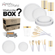 An assortment of disposable tableware is displayed, including white dinner plates with silver rims, clear color tumblers with gold rims, and gold forks, knives, and spoons. A box labeled "Smarty Had a Party!" with "What's in the Box?" text and a "Free Shipping" icon is shown. The product featured is the Clear Flat Round Disposable Plastic Tableware Set by Smarty had a party.