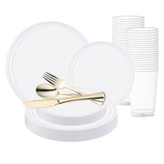 The White Flat Round Disposable Plastic Wedding Value Set is displayed, featuring white dinner plates, stacked tall plastic cups, and shiny gold-colored flatware, including a fork, knife, and spoon arranged on a smaller plate. Multiple plates are stacked underneath for a hassle-free dining experience.