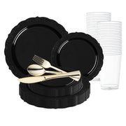 The Smarty had a Party Black Vintage Rim Round Disposable Plastic Wedding Value Set features black disposable plastic plates in various sizes with gold-colored flatware (including forks, spoons, and knives) placed on top. Clear plastic cups are stacked to the side. Designed as a chic service for 20, this arrangement creates a modern, elegant table setting.