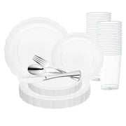 Introducing the Clear Vintage Round Disposable Plastic Wedding Value Set by Smarty had a party. This BPA-free dinnerware includes white plates in various sizes, clear cups that are neatly stacked at the back, and elegant silver cutlery featuring a fork, knife, and spoon. Designed to serve 20 guests, this set ensures both convenience and sophistication for any gathering.