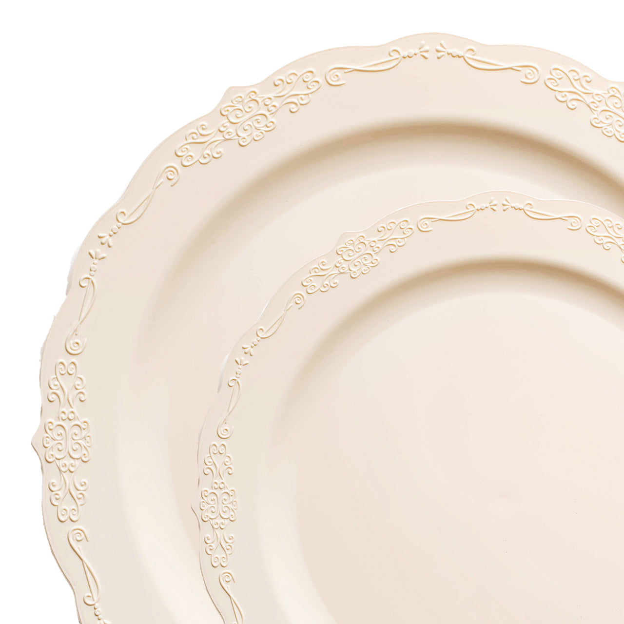 Close-up view of two overlapping plates from the Ivory Vintage Round Disposable Plastic Dinnerware Value Set by Kaya Collection, showcasing ornate, decorative edges. The intricate design along the rims features floral and scroll patterns, giving these one-time use plates an elegant and vintage appearance, reminiscent of fine ceramic dinnerware.