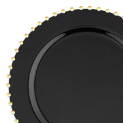 Introducing our Black with Gold Pearl String Round Disposable Plastic Dinner Plates (10”), designed to exude a minimalist and elegant appeal. Each 10-inch plate boasts a glossy black finish, beautifully accented with a circular arrangement of small, uniformly placed gold pearl-like beads around the edge. Ideal for sophisticated decorative or dining settings, these plates are perfect for those seeking stylish and practical disposable dinnerware options.