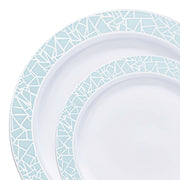 Close-up of two plates from the Kaya Collection's White with Turquoise Blue and Silver Mosaic Rim Round Plastic Dinnerware Value Set, featuring intricate light blue geometric patterns along the rims. The design resembles artistically arranged cracked glass fragments, adding an elegant touch to these otherwise simple plates.