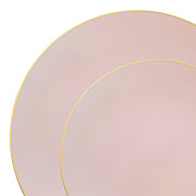 The image highlights a close-up view of two overlapping plates from the Pink with Gold Organic Round Disposable Plastic Dinnerware Value Set. These pastel pink, BPA-free disposable plates feature a thin gold rim, exuding elegance and minimalism with a sophisticated touch created by the subtle gold detail.