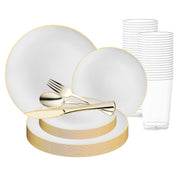 The White with Gold Rim Organic Round Disposable Plastic Wedding Value Set by Smarty Had a Party is an elegant disposable dinnerware collection. It features white plates with gold trim, gold-colored utensils (fork, knife, and spoon), and clear plastic cups stacked in the background. This BPA-free set includes plates of varying sizes, arranged neatly to serve 20 guests.