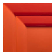 Close-up of two stacked Burnt Orange Square Plastic Plates from the Kaya Collection. Both plates feature shades of burnt orange and red, with their visible corners showcasing a minimalist and sleek design that highlights the modern aesthetic of this single-party-use dinnerware set.