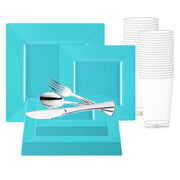 The Sea Aqua Square Disposable Plastic Wedding Value Set includes a set of turquoise square plastic plates in various sizes that are BPA-free and perfect for parties, along with stacks of clear disposable cups and a selection of silver plastic cutlery—forks, spoons, and knives—neatly arranged on the plates, providing a convenient service for 20.