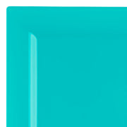 A close-up image showcasing a vibrant Sea Aqua Square Plastic Dinner Plate (9.5") with a glossy finish, resembling elegant wedding party plates, featuring a slightly raised edge. The bright turquoise color and simple design of the plate are clearly visible, taking up the entire frame of the image.