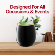 On a wooden surface sits a sleek 12 oz. black and gold elegant stemless plastic wine glass from the Kaya Collection, filled with a refreshing beverage and garnished with mint leaves and lemon slices. Bold red text behind the wine glass reads, "Designed for All Occasions & Events," while modern stemless wine glasses appear blurred in the background.