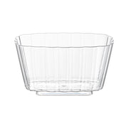 The 5.5 oz. Clear Fluted Rectangular Disposable Plastic Pudding Cups are designed with a rectangular shape and vertical fluted patterns along the sides. These cups feature a flat, rectangular base for added stability, making them simple yet elegant tableware suitable for holding various contents at parties.