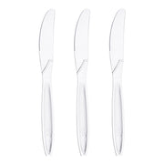 Image of three stainless steel butter knives placed vertically in a row against a white background. Each knife has a serrated edge on one side and a smooth, reflective handle, highlighting the contrast with Clear Plastic Disposable Knives typically used for convenience.