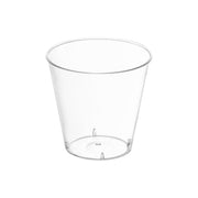 A 1 oz. Clear Plastic Shot Glass from Kaya Collection, BPA-free and disposable, featuring a wide rim that tapers down to a narrower base, set against a plain white background.