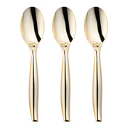 Three Gold Disposable Plastic Serving Spoons are arranged side by side against a plain white background. Each spoon boasts a smooth, reflective surface and a sleek, rounded handle, giving them a modern and elegant appearance. These fancy disposable spoons add a touch of sophistication to any setting.