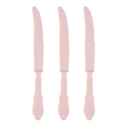 A set of three Pink Baroque Disposable Plastic Dinner Knives, featuring curved serrated blades and ornate handles with intricate bead-like patterns, is elegantly displayed vertically in a row against a white background.