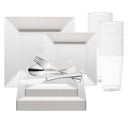 A set of white, square plastic plates in various sizes, stacked on top of each other, with silver plastic flatware (forks, knives, and spoons) and clear plastic cups in the background. This White Square Plastic Wedding Value Set by Smarty had a party is arranged neatly, showcasing a BPA-free tableware collection.