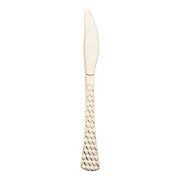 A single Shiny Gold Glamour Cutlery Disposable Plastic Knife featuring a textured handle and a serrated edge is centered against a plain white background. The handle boasts an elegant teardrop pattern, reminiscent of sophisticated disposable cutlery, enhancing the decorative look of the utensil.