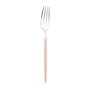 A Silver with Pink Handle Moderno Disposable Plastic Dinner Fork featuring a shiny, polished head with four tines. The sleek and glossy light pink handle contrasts beautifully with the metallic part, embodying the essence of modern dining tableware for a stylish look.